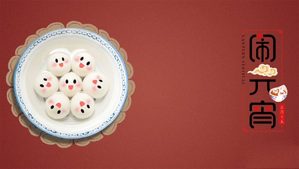 Colorful traditional Asian steamed buns with cute facial expressions on a decorative plate, celebrating Lunar New Year.