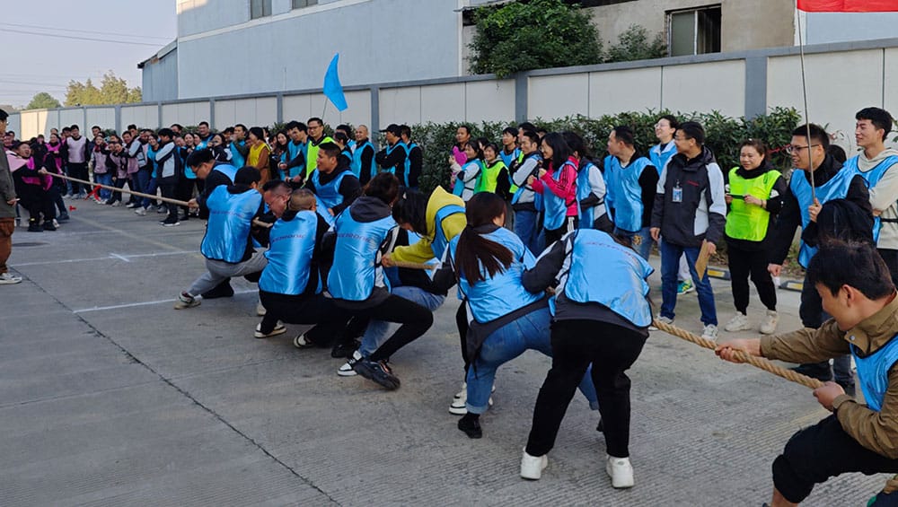 Competitive team building activity at COSMICONN company event.