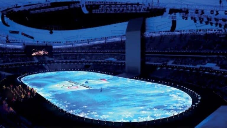 Stadium ice rink with Olympic rings at winter sports event during the Olympics.