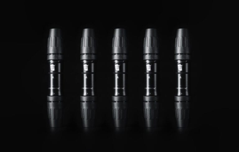 Microphone capsule with black background for professional audio recording.